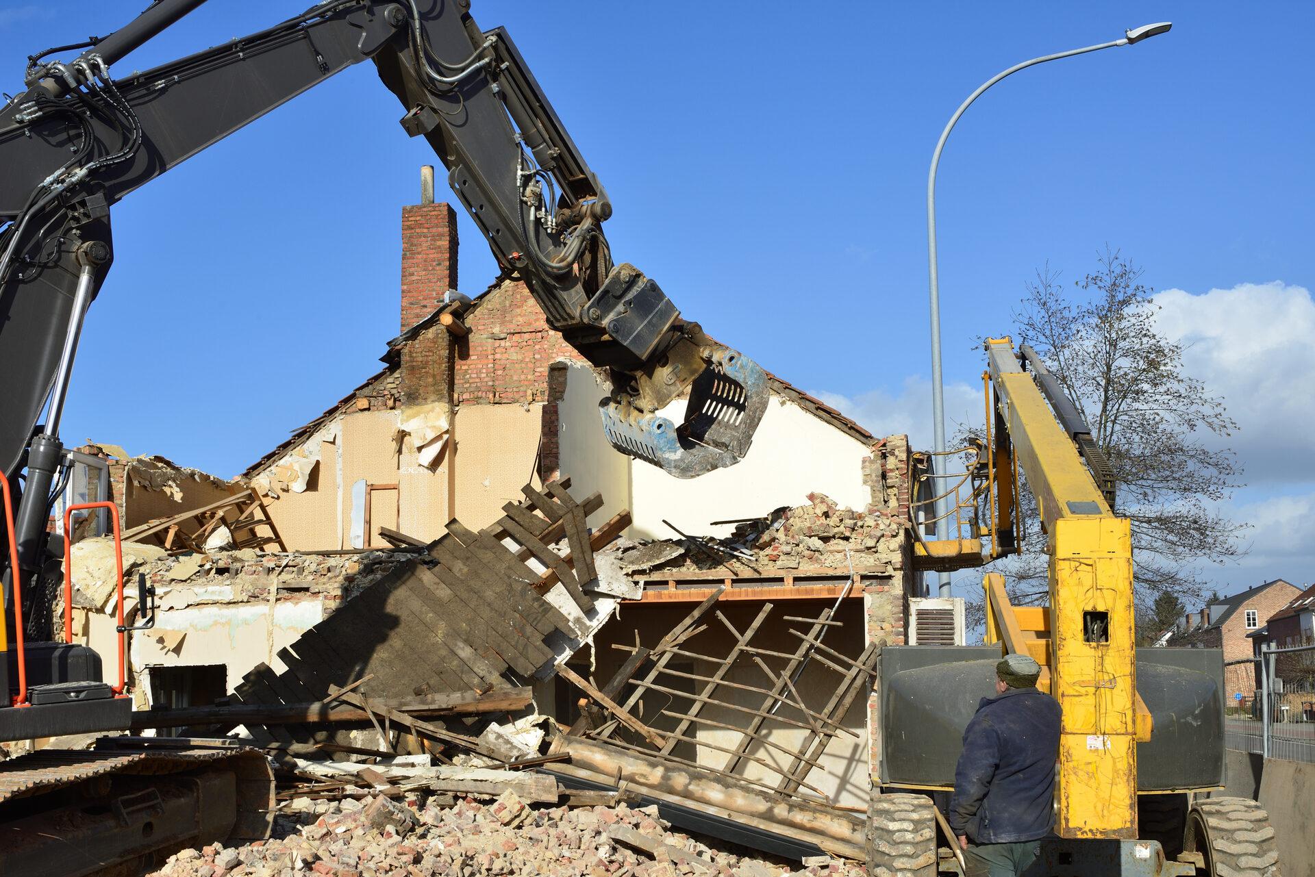 Excavator demolishing a structure