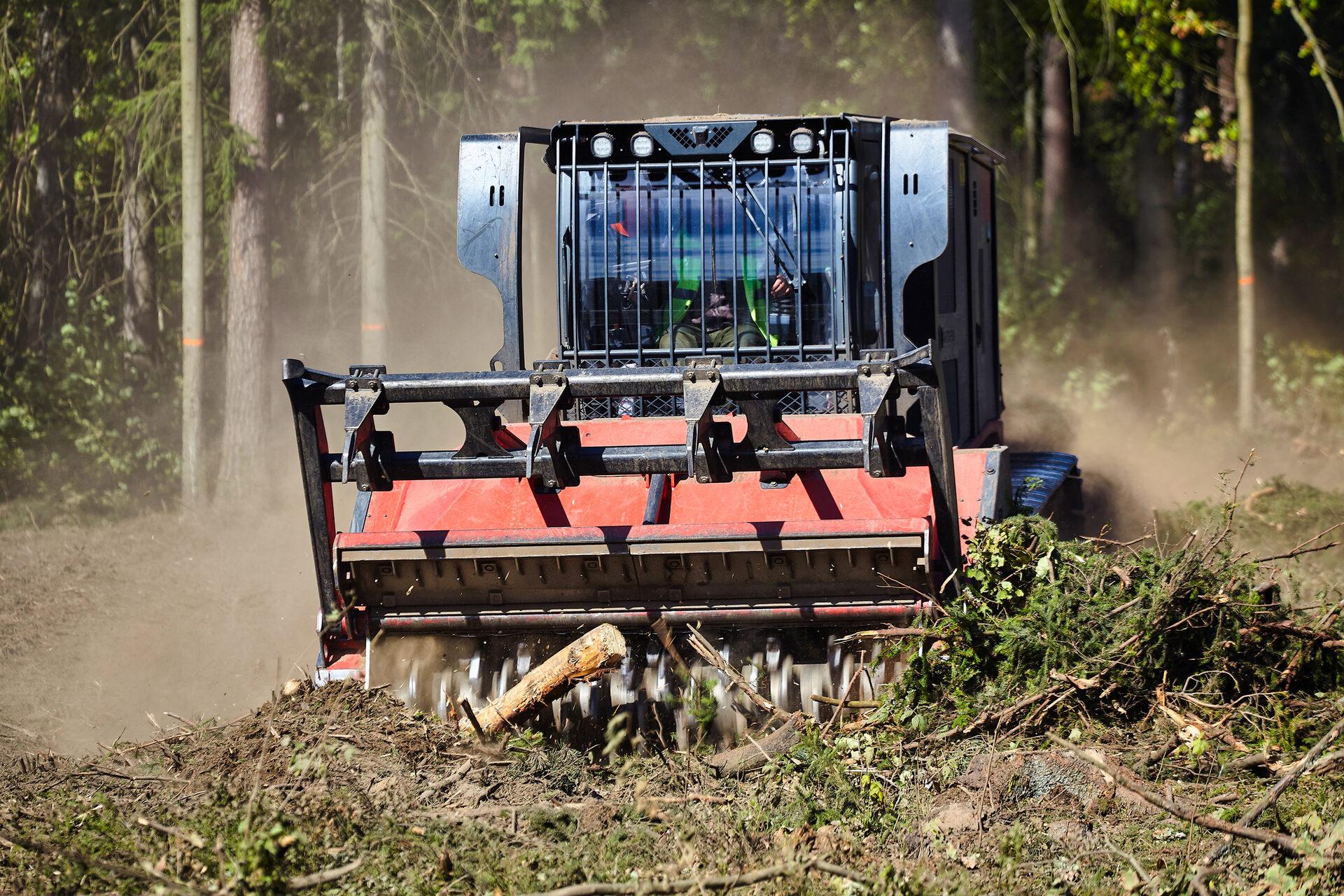 Forestry mulcher grinding brush and vegetation